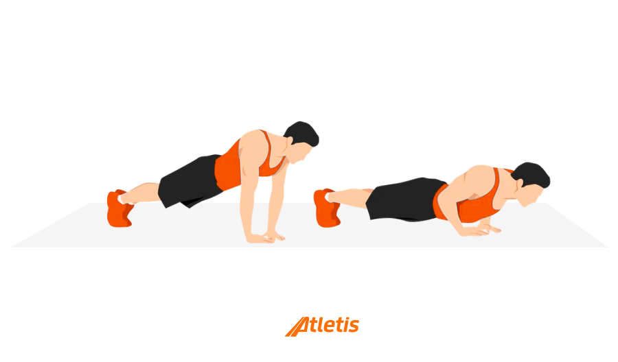 Duas pessoas realizando o exercício de flexão na posição de prancha, uma em pé na posição de apoio com as mãos no chão e a outra apoiada com os cotovelos, ambos usando roupas esportivas na cor laranja e preto, praticando exercício de força e fortalecimento muscular.
