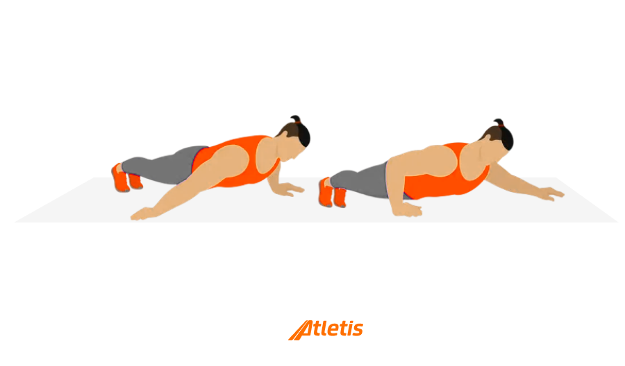 Duas mulheres realizando a prancha, um exercício de fortalecimento abdominal e físico, em uma academia, usando roupas esportivas laranja e cinza.